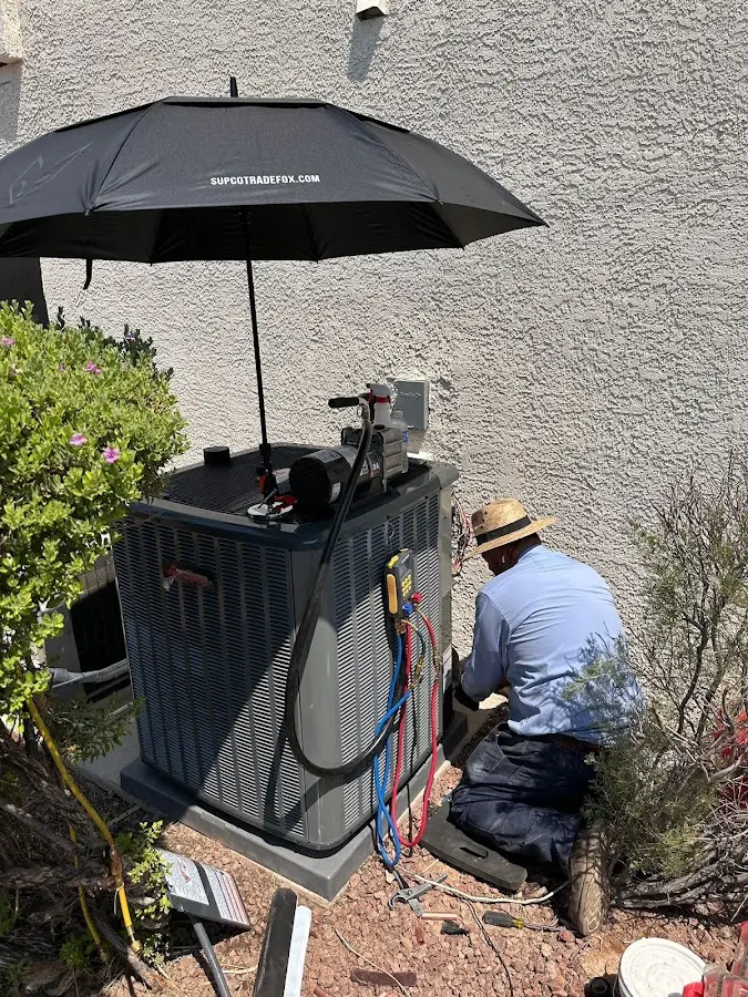 HVAC technician performing outdoor AC maintenance in Normandy Park